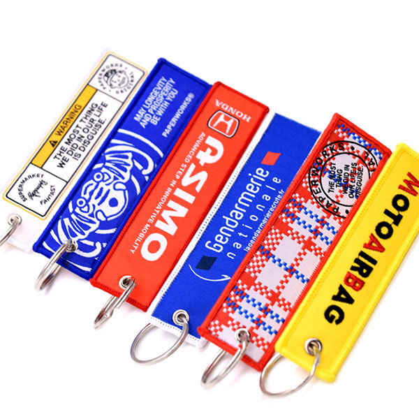 Custom Promotional Logo Cute Anime Remove Before Flight Crew Double Sided Woven Fabric Embroidery Key Jet Tag Keychain