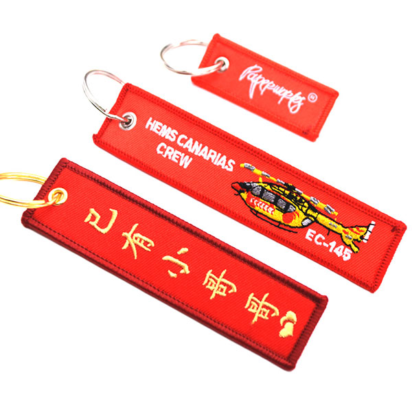 Custom Promotional Logo Cute Anime Remove Before Flight Crew Double Sided Woven Fabric Embroidery Key Jet Tag Keychain