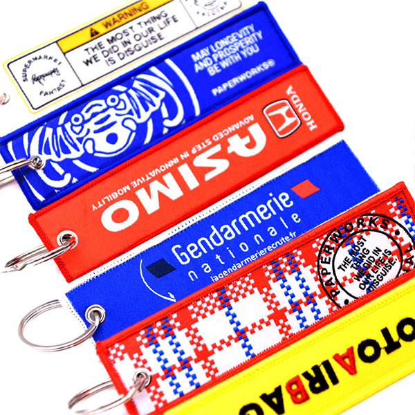 Custom Promotional Logo Cute Anime Remove Before Flight Crew Double Sided Woven Fabric Embroidery Key Jet Tag Keychain
